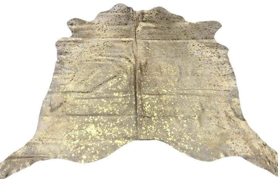 Gold metallic cowhide rug with speckled finish on natural hide displayed as a full rug