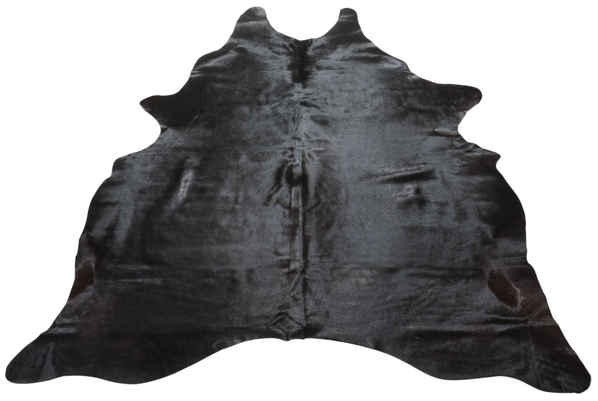 Natural black cowhide rug example showing rich dark tones and subtle variation on a white background