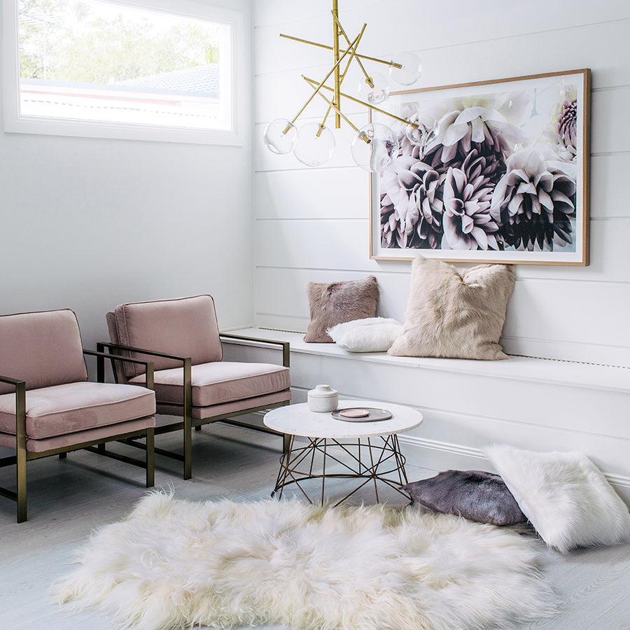 Icelandic sheepskin floor rug in natural white crafted from three hides stitched together, styled in a living room