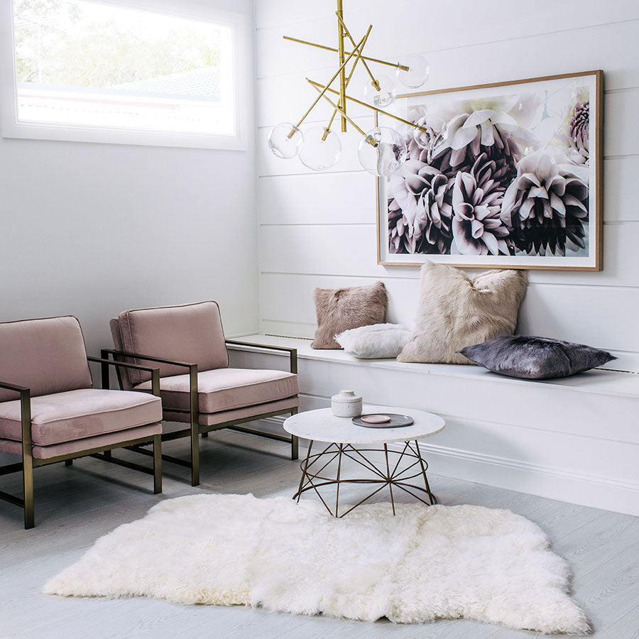 Icelandic shorn sheepskin floor rug in natural white made from three hides stitched together, styled in a contemporary living room