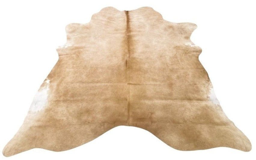 Beige cowhide rug example showing natural shape, soft tonal variation and smooth hair on a white background