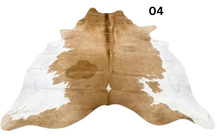 Beige and white cowhide rug No. 04 with unique natural markings and colour variation.