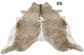 Beige and white cowhide rug No. 05 featuring soft neutral tones and natural hide character.