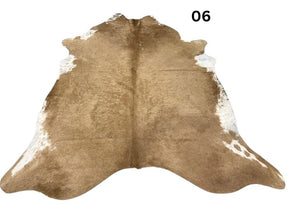 Beige and white cowhide rug No. 06 featuring soft neutral tones and natural hide character.