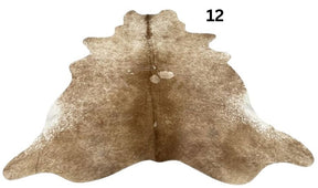 Beige and white cowhide rug No. 12 featuring soft neutral tones and natural hide character.