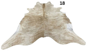 Beige and white cowhide rug No. 18 featuring soft neutral tones and natural hide character.