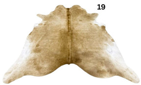 Beige and white cowhide rug No. 19 featuring soft neutral tones and natural hide character.