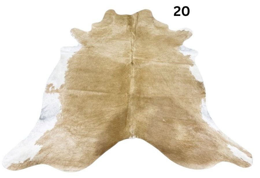 Beige and white cowhide rug No. 20 featuring soft neutral tones and natural hide character.