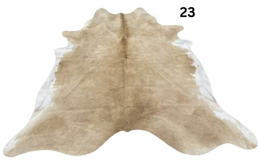 Beige and white cowhide rug No. 23 featuring soft neutral tones and natural hide character.
