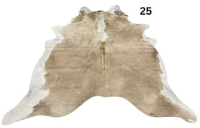 Beige and white cowhide rug No. 25 featuring soft neutral tones and natural hide character.