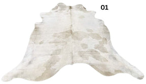 Beige and white special cowhide rug 01 featuring natural markings, genuine hair-on-hide leather and one-of-a-kind patterning.