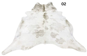 Beige and white special cowhide rug 02 featuring natural markings, genuine hair-on-hide leather and one-of-a-kind patterning.