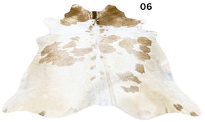 Beige and white special cowhide rug 06 featuring natural markings, genuine hair-on-hide leather and one-of-a-kind patterning.