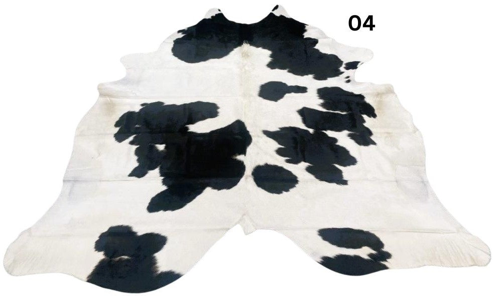 Black and white cowhide rug number 04 with bold contrast markings on a white background