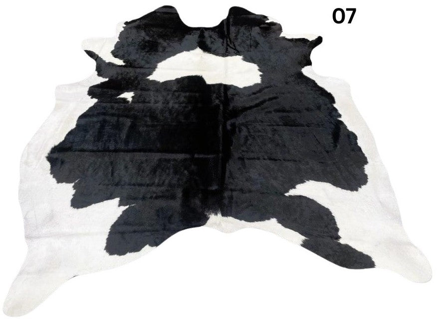 Black and white cowhide rug number 08 with bold contrast markings on a white background