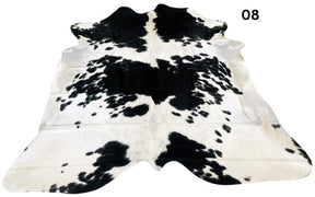 Black and white cowhide rug number 08 with bold contrast markings on a white background