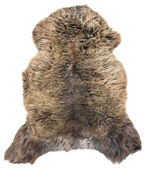 British sheepskin rug in natural dark brown tones shown as a full hide on a white background
