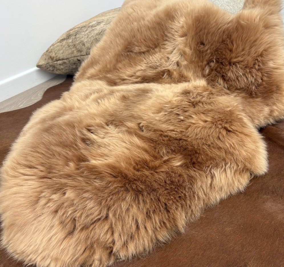 Butterscotch Merino sheepskin rug shown in full natural hide shape