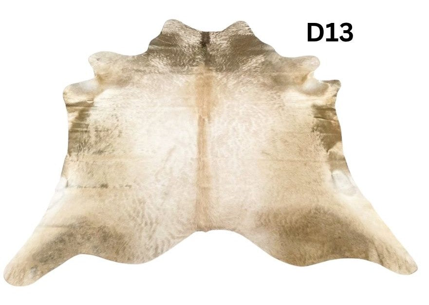 Champagne cowhide rug number 13 with soft neutral tones and natural markings on a white background