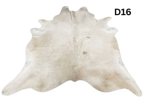 Champagne cowhide rug number 16 with soft neutral tones and natural markings on a white background