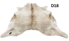 Champagne cowhide rug number 18 with soft neutral tones and natural markings on a white background