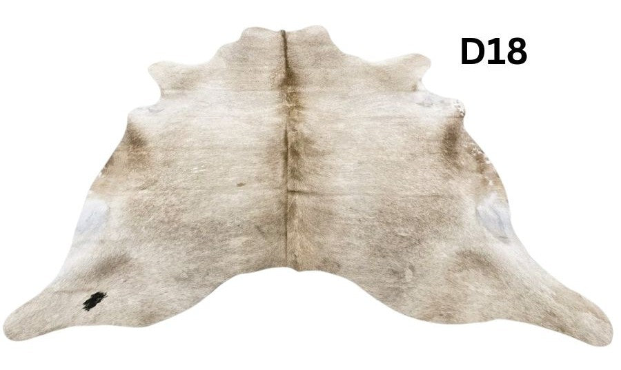 Champagne cowhide rug number 18 with soft neutral tones and natural markings on a white background