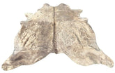 Champagne cowhide rug example showing soft neutral tones with natural variation and smooth hair on a white background