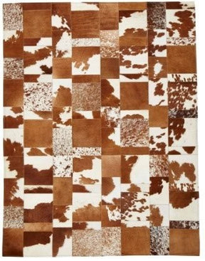 Cowhide patchwork rug in brown and white tones with square panel design