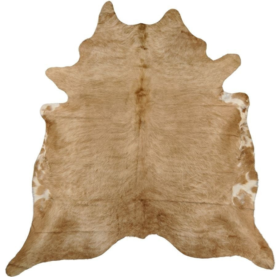 Example of a beige and white cowhide rug showing typical colour tones and natural variation