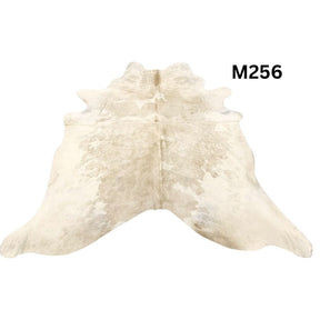 Beige and white cowhide rug with natural tonal variation shown on a white background