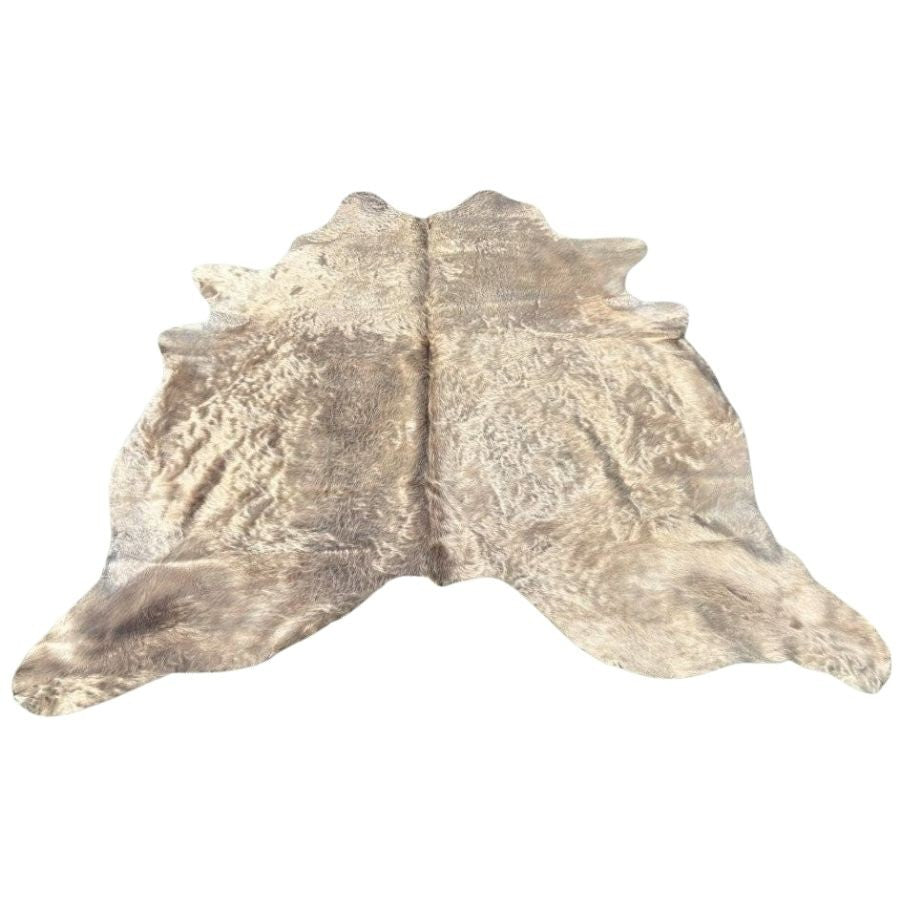 Example of a champagne cowhide rug showing typical colour tone and natural variation