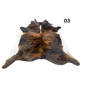 White belly cowhide rug with white spine and natural tonal variation shown on a white background