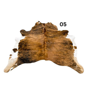  belly cowhide rug with white spine and natural markings shown on a white background