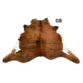  belly cowhide rug with white spine and natural markings shown on a white background
