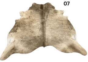 Dark Champagne cowhide rug No. 07 featuring soft champagne and earthy natural tones.