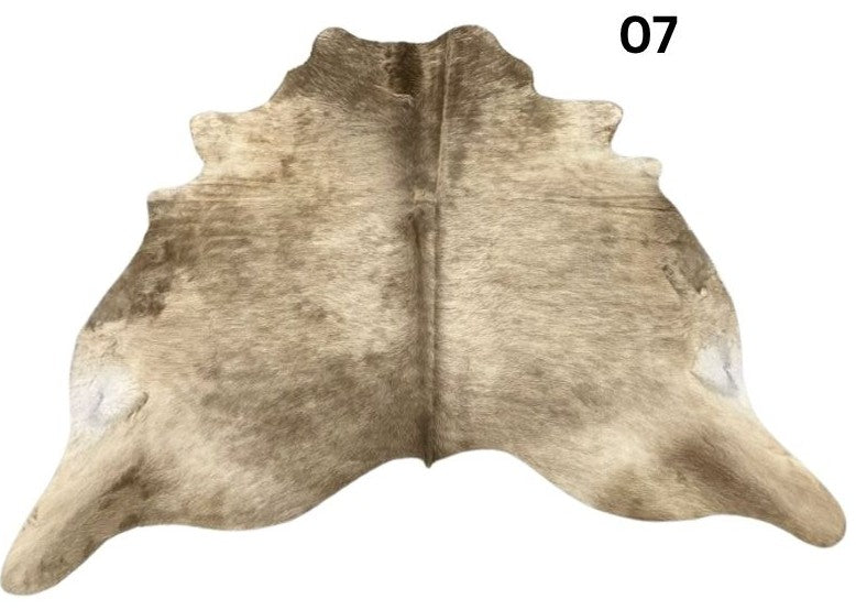 Dark Champagne cowhide rug No. 07 featuring soft champagne and earthy natural tones.
