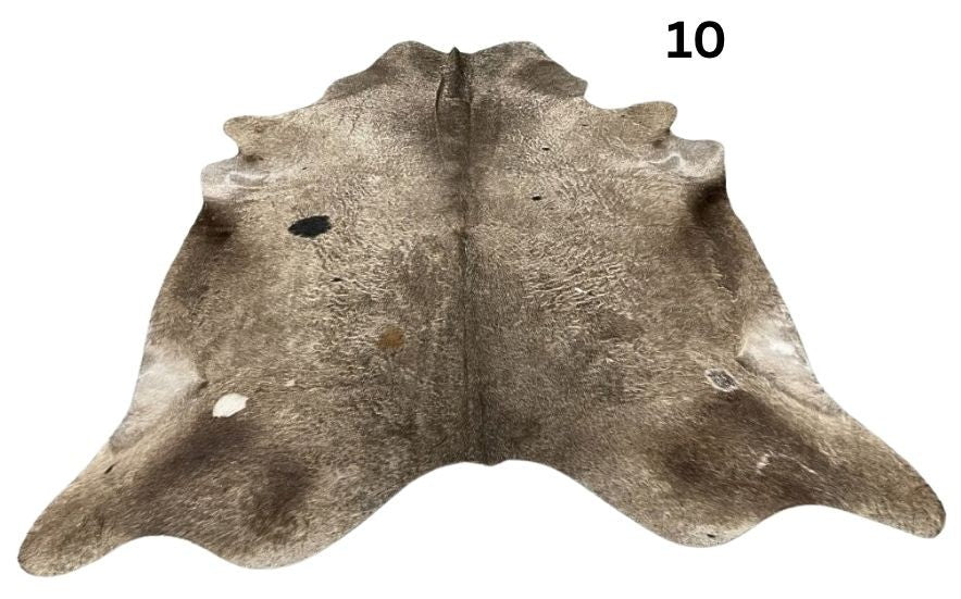 Dark Champagne cowhide rug No. 10 with a natural hair-on-hide finish.
