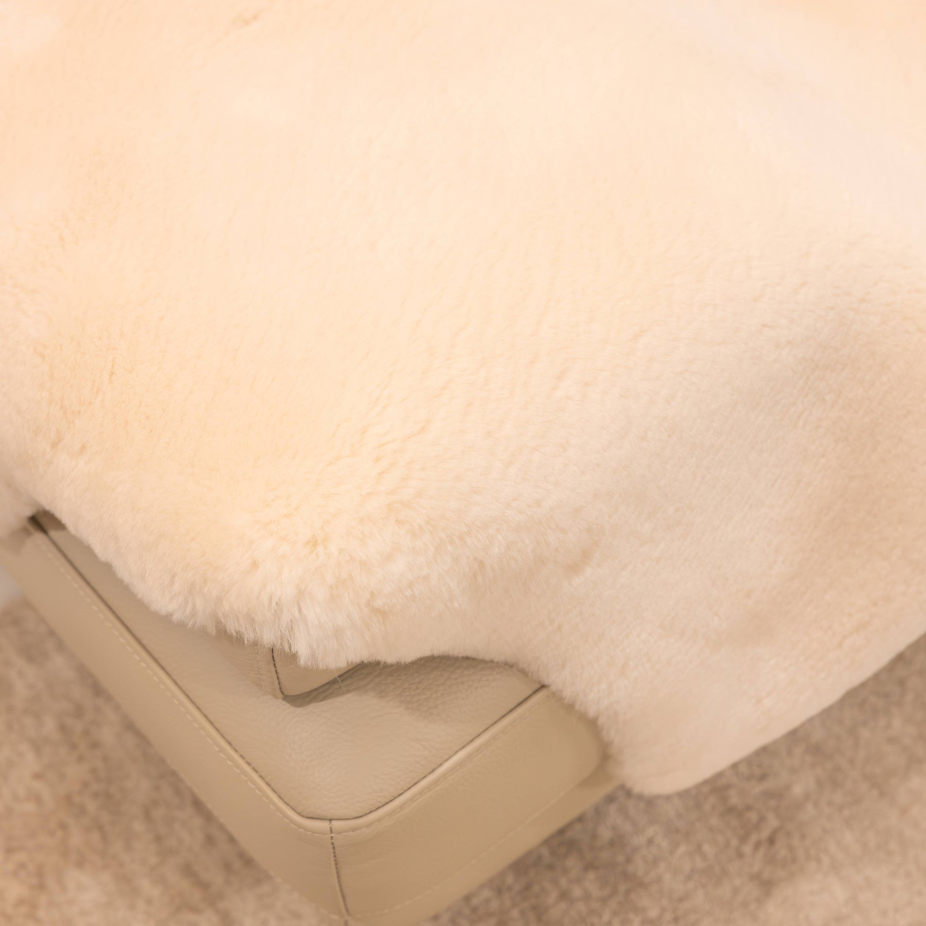 Close-up of dusk sheepskin baby rug showing dense wool pile and softly finished edge