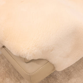 Close-up of dusk sheepskin baby rug showing dense wool pile and softly finished edge