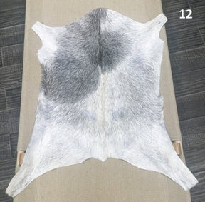 Natural goatskin hide rug shown individually