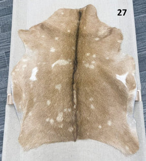 Natural goatskin hide rug shown individually