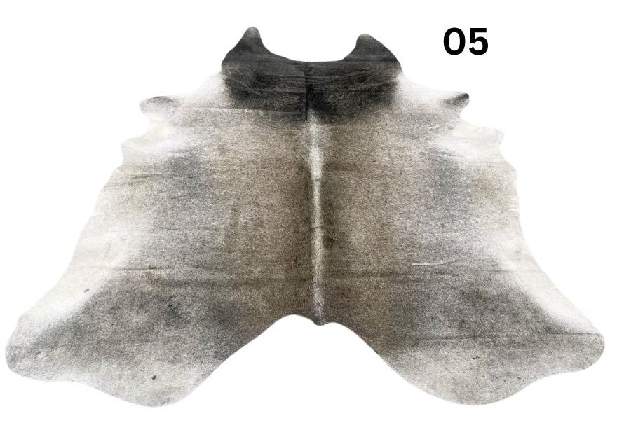 Grey cowhide rug number 05 with soft tonal variation and natural markings on a white background