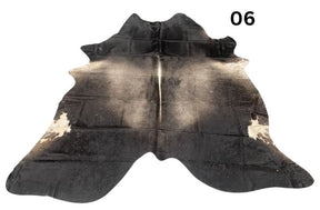 Grey cowhide rug number 06 with soft tonal variation and natural markings on a white background