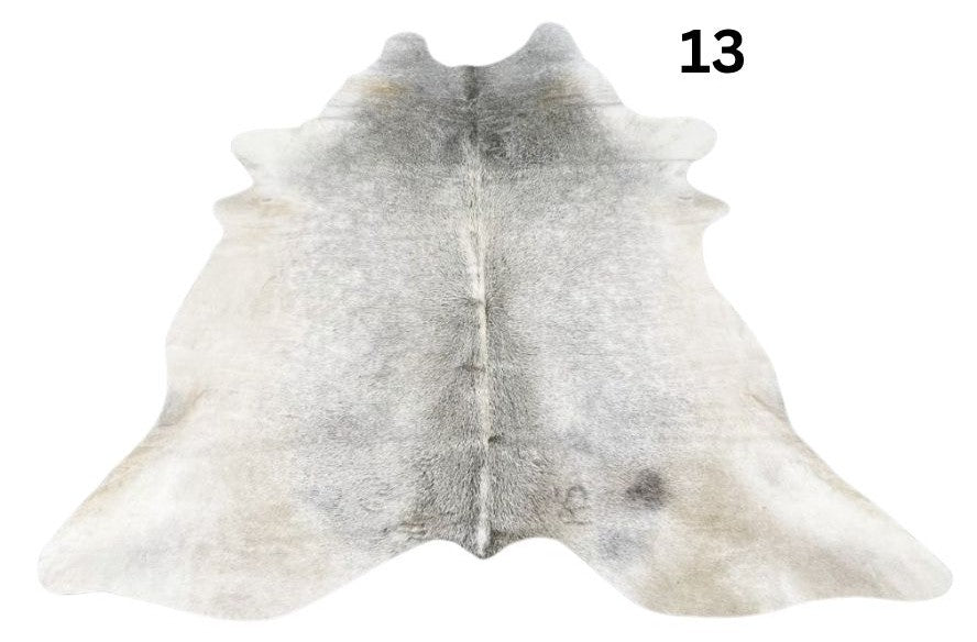 Grey cowhide rug number 13 with soft tonal variation and natural markings on a white background
