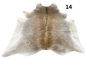 Grey cowhide rug number 14 with soft tonal variation and natural markings on a white background