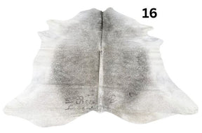 Grey cowhide rug number 16 with soft tonal variation and natural markings on a white background