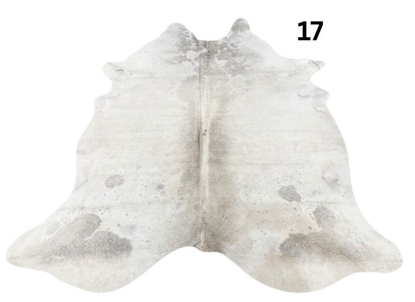 Grey cowhide rug number 17 with soft tonal variation and natural markings on a white background