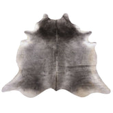Grey cowhide rug example showing soft tonal variation and natural markings on a white background
