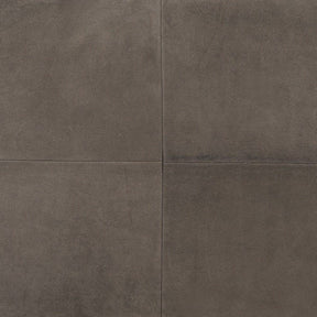 Close up of grey nubuck leather cushion showing soft matte texture and panel seam detail