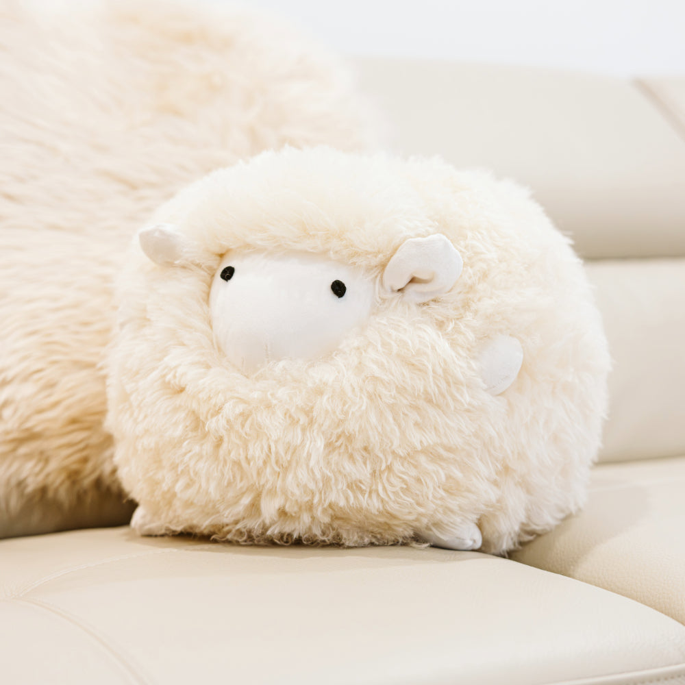 Close-up of Harold small sheepskin toy made from natural cream sheepskin